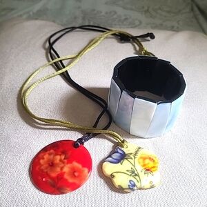 1 red and 1 yellow shell necklace and a 1 white shell bracelet.